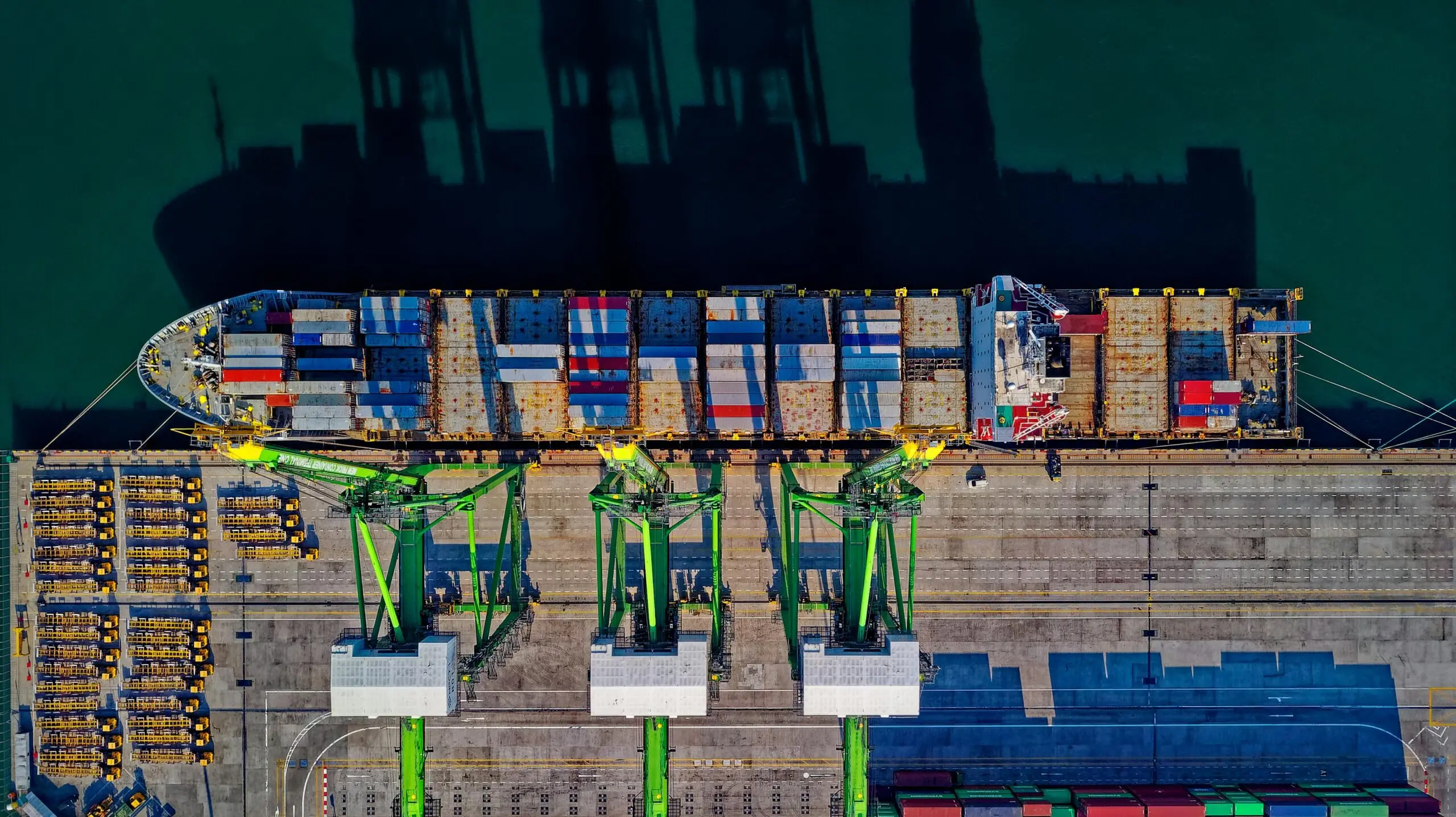 a ship at the dock with containers on it 